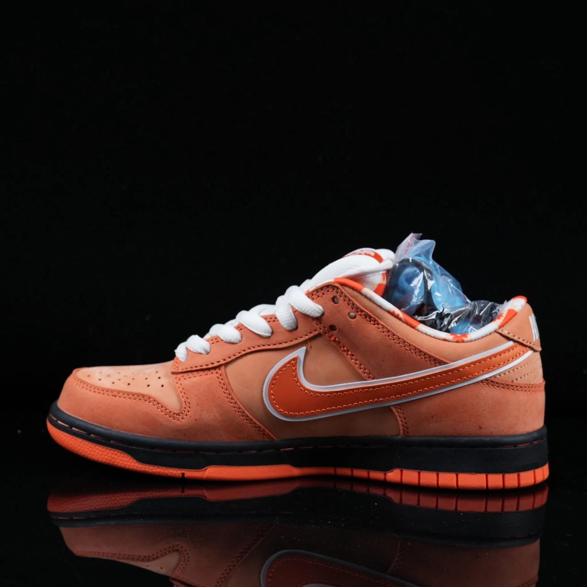 x CONCEPTS Dunk SB Orange Lobster FD8776-800